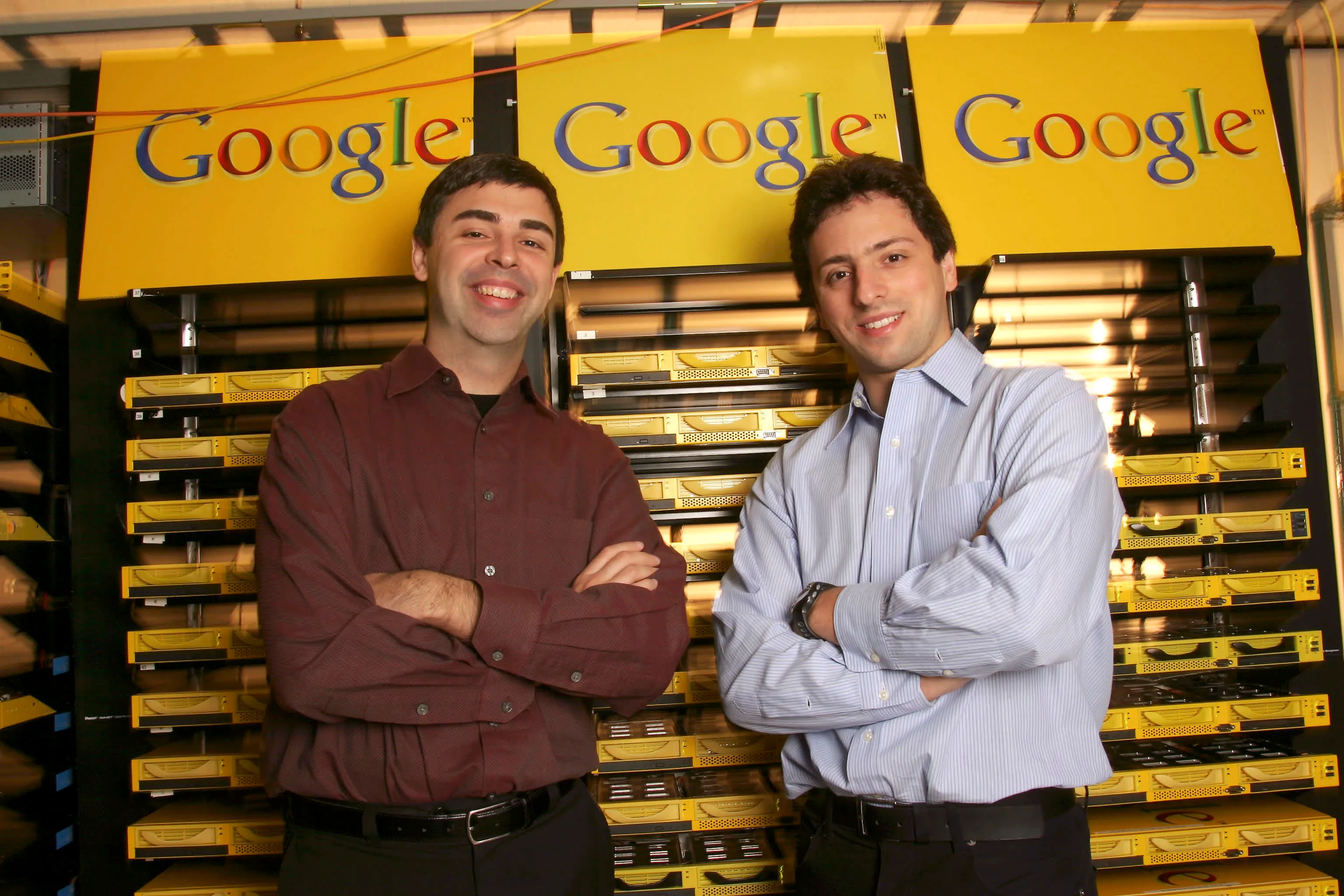 Larry Page and Sergey Brin in front of Google server rack, 2003